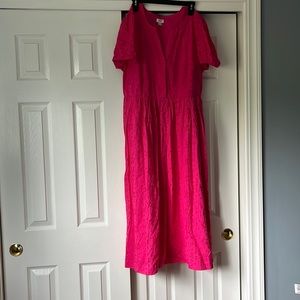 NWOT eyelet midi dress never worn. Fully lined, pockets, side zip